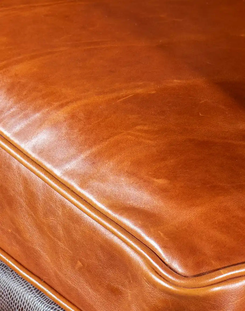 A detailed shot of the luxurious pull-up leather, showcasing its rich tones and natural variations.