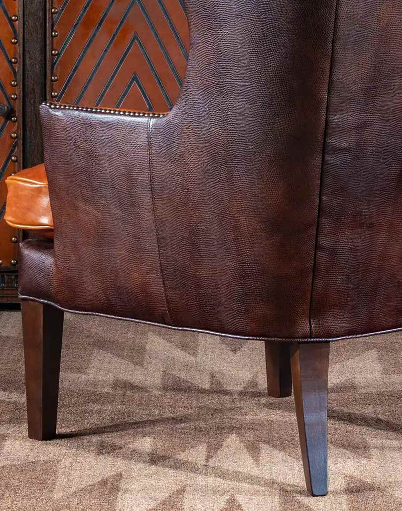 Close-up of the stamped lizard pattern on the chair’s back, adding a unique and sophisticated design element.