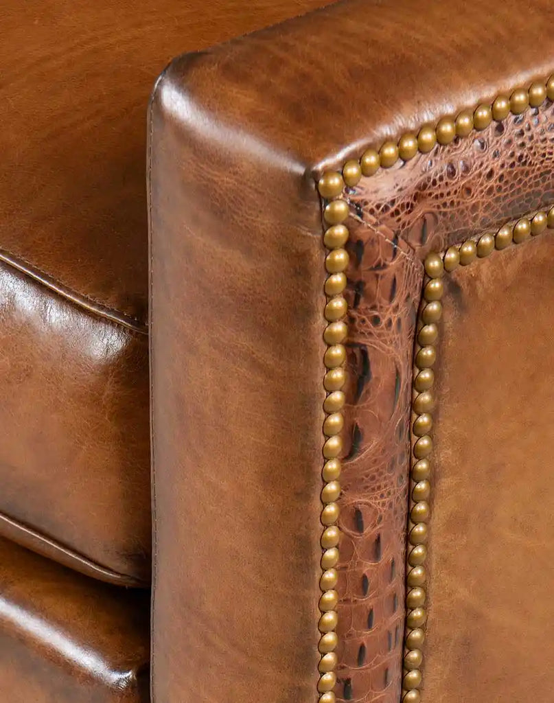 Close-up of the armrest on the Colorado Leather Sofa, showcasing the rich leather and precision stitching.