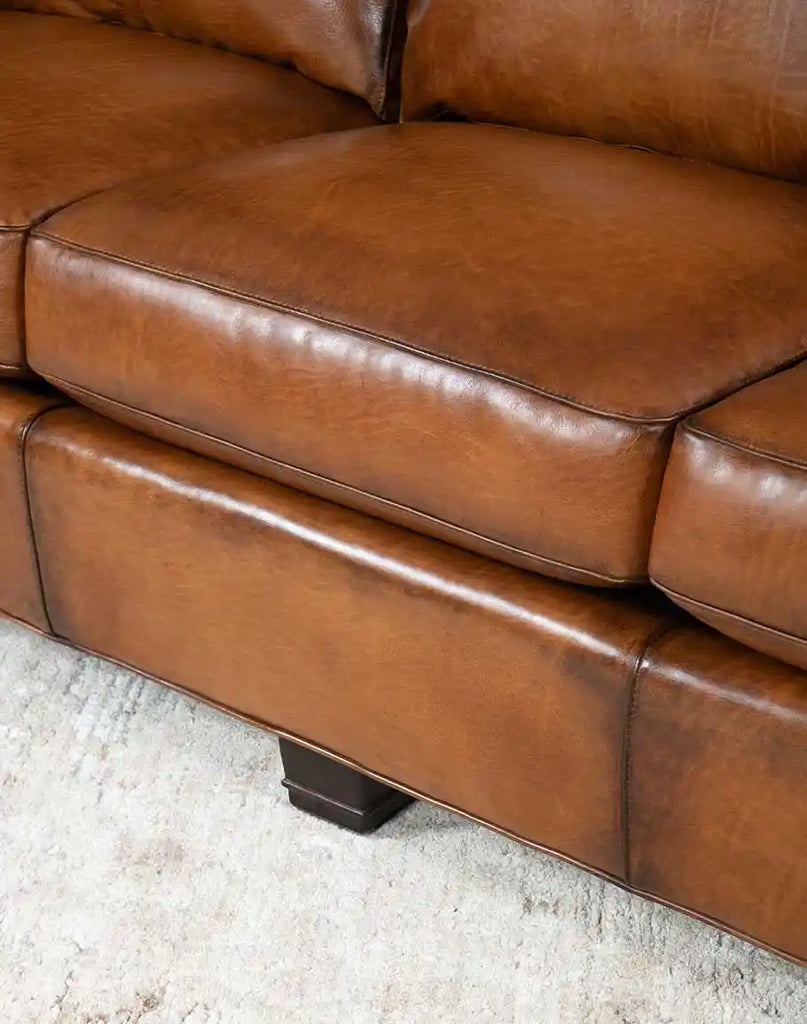 Close-up of the plush seat cushions on the Colorado Leather Sofa, emphasizing their comfort and high-quality leather finish.