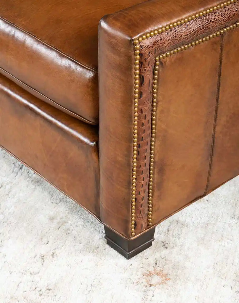 Detailed view of the sturdy wooden frame and legs of the Colorado Leather Sofa, adding stability and elegance to its design.