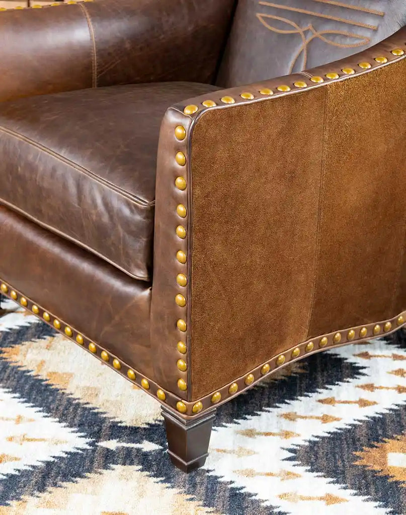 View of the generously cushioned seat of the Cassie Brown Leather Chair for ultimate comfort.