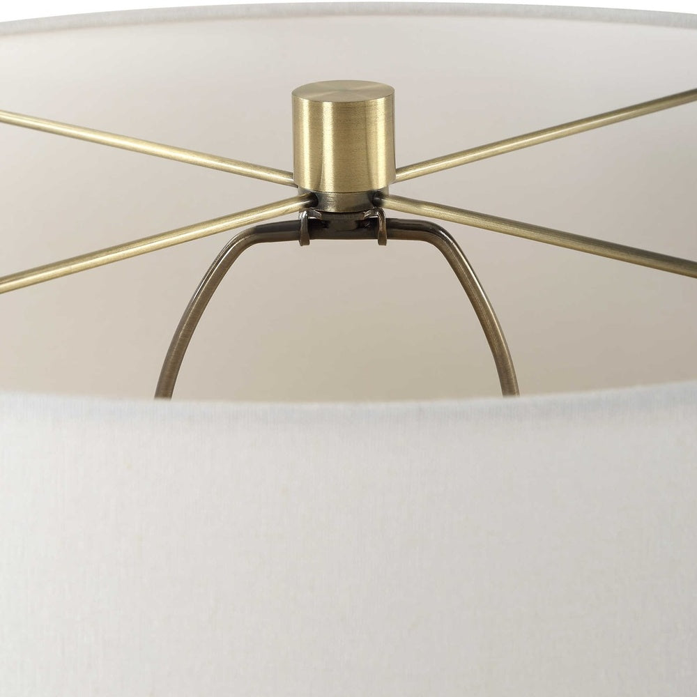 Stylish seeded glass and brass table lamp with a bright white drum shade for a contemporary look.