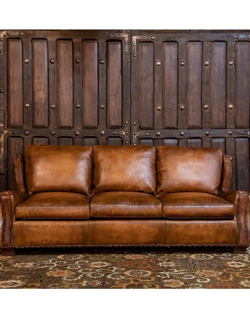 A full-length shot of the Cowboy Leather Sofa, emphasizing its stylish aesthetics and premium craftsmanship.