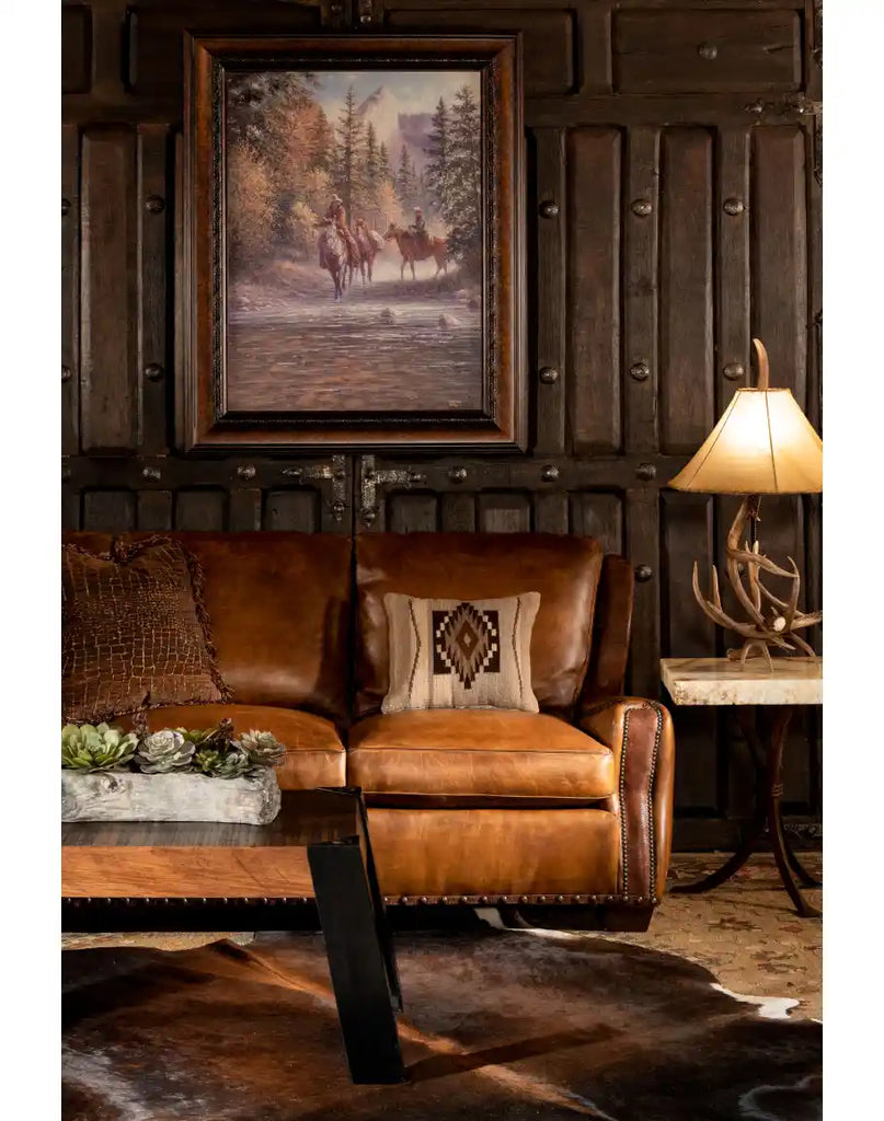 Cowboy Leather Sofa showcasing its premium leather upholstery, whip-stitched arms, and brass nail head detailing.