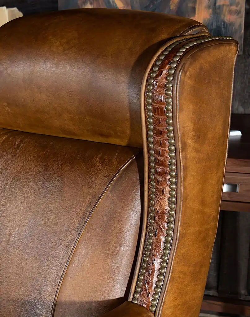 Close-up of the brass button embellishments on the wings of the Cowboy Saddle Executive Desk Chair, adding a sophisticated touch to the design.