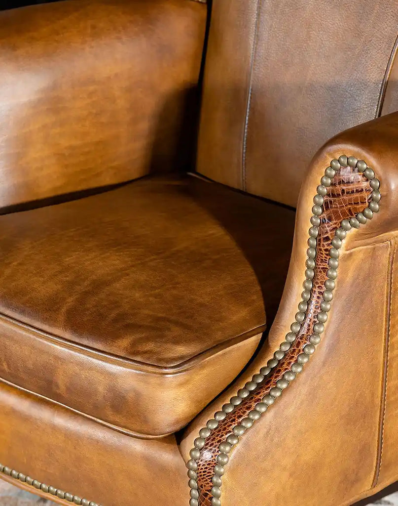 Close-up of the top grain leather seat of the Cowboy Saddle Executive Desk Chair, emphasizing its smooth texture and hand-stitched edges.