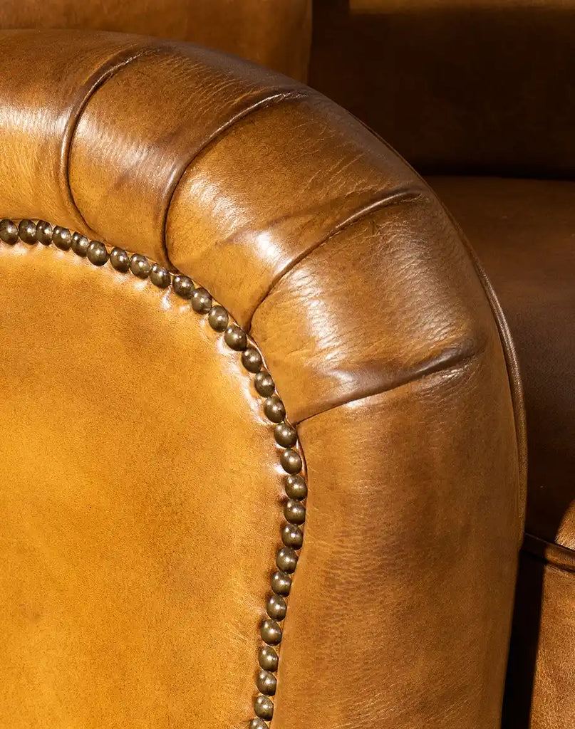 Detailed view of the hand-burnished leather on the Cullen Saddle Leather Recliner, showcasing its rich patina and premium quality.