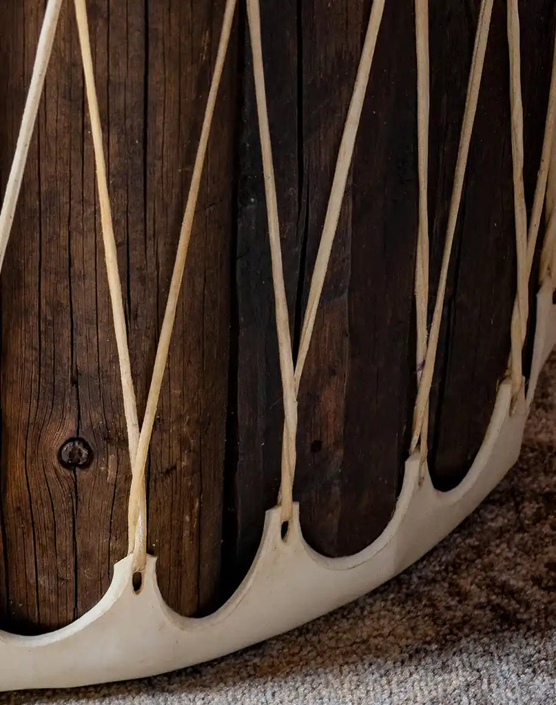 A detailed close-up of the natural wood grain on the Cylinder Accent Table, emphasizing its rustic yet sophisticated texture.