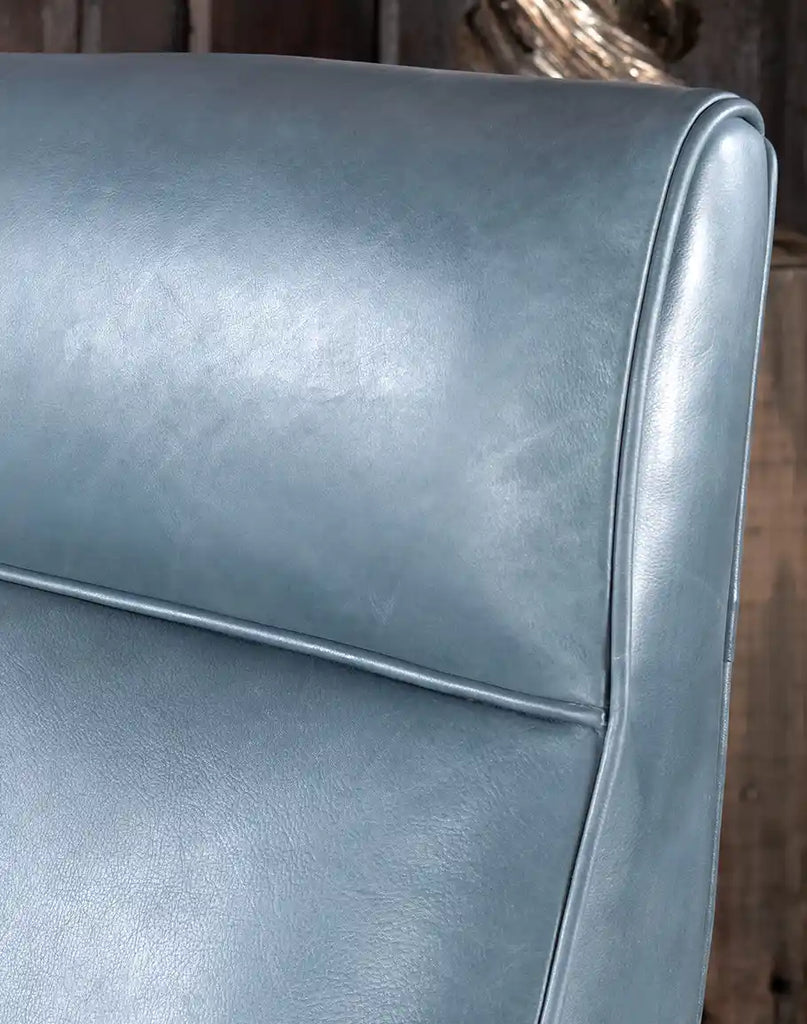 A detailed close-up of the premium top-grain grey leather on the Daenerys Grey Recliner, showcasing its rich texture and elegant hand-burnished finish.