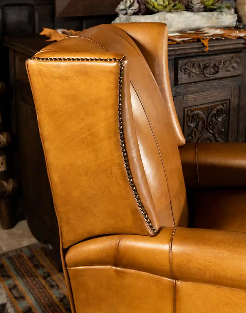 Side view displaying the sleek armrest design and smooth lines of the Dakota Saddle Recliner.