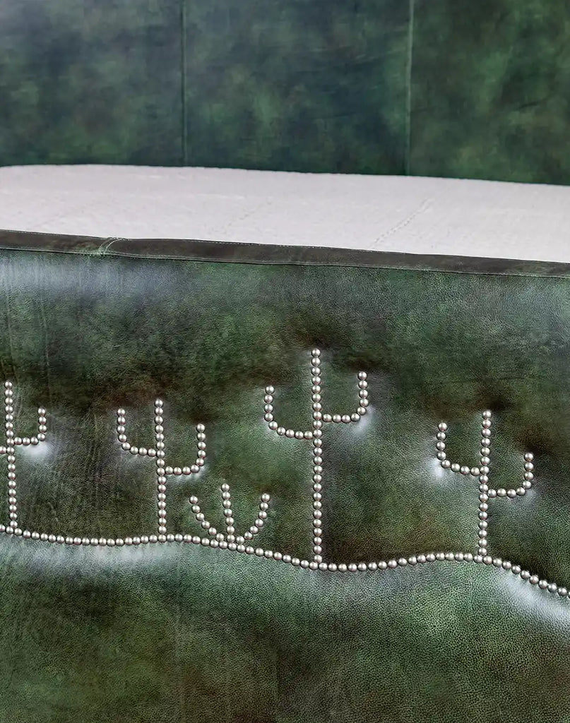 A close-up of the Dark Green Cacti Bed’s footboard, adorned with cactus-shaped nickel nail trim for a unique accent.