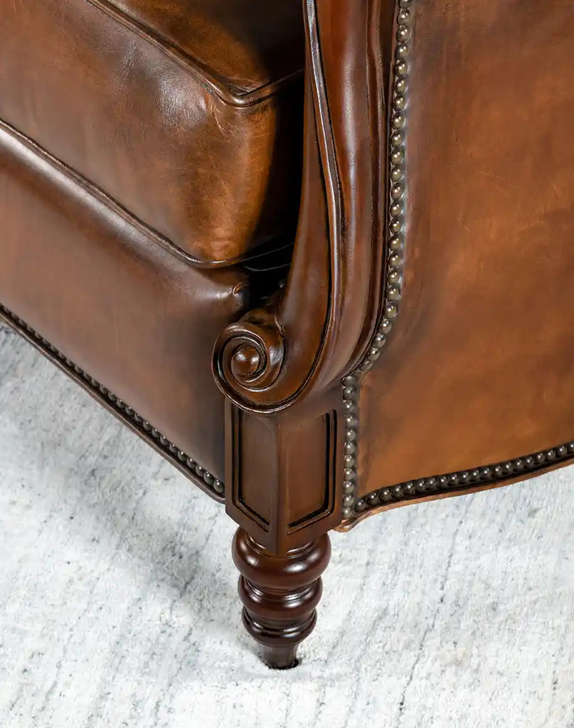 Close-up of the Cameron Leather Recliner’s leg, showcasing the handcrafted solid hardwood and durable construction.