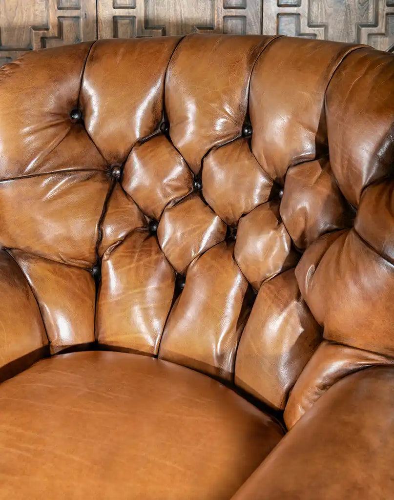 A detailed view of the deep button tufts on the King Arthur Tufted Chair, enhancing its aesthetic and providing superior comfort.