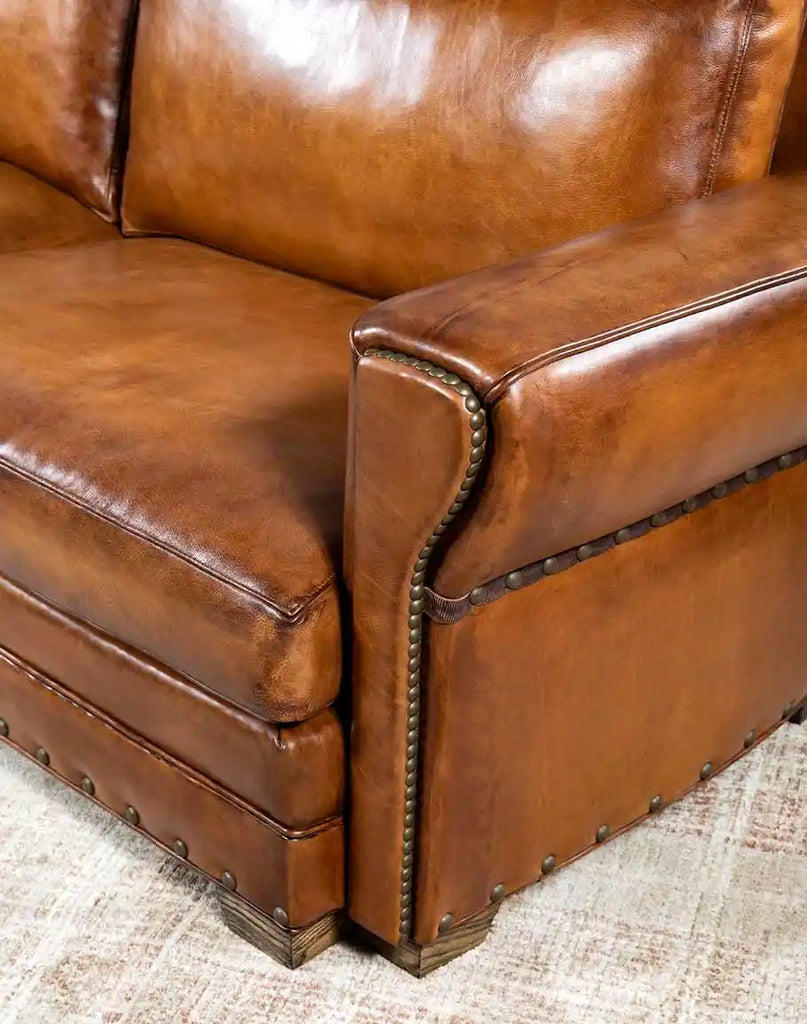 Detailed view focusing on the unique tapered armrest design for enhanced comfort on the Herdsman Leather Sofa.