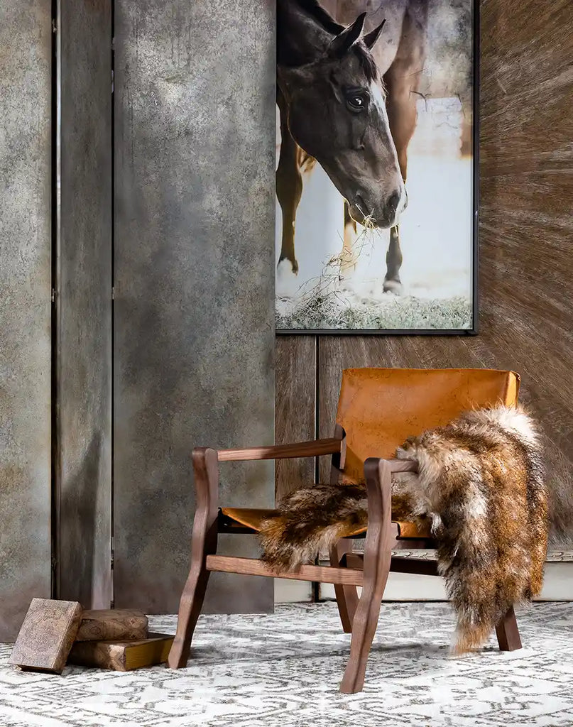 The Diego Sling Chair styled in a modern rustic living room, complementing the décor with its natural textures.