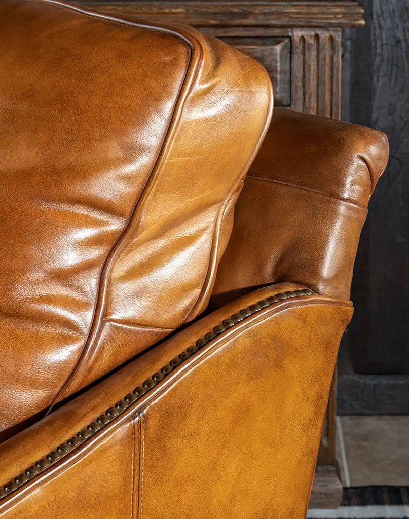 Detailed shot focusing on the rich, full grain leather texture of the Don Juan Swivel Glider.