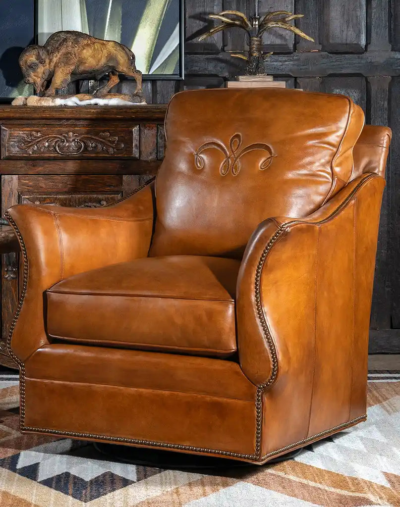 Front-facing image showcasing the full design of the Don Juan Swivel Glider, highlighting its full grain leather and luxurious western style.