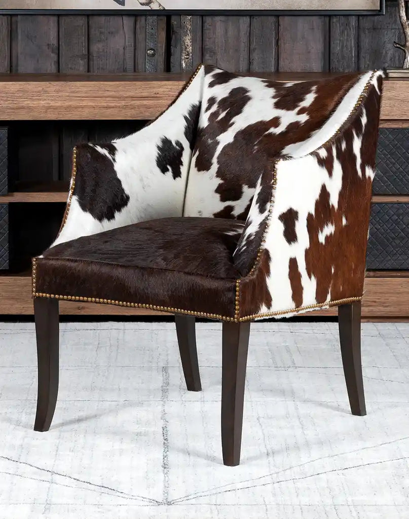 Ebony Cowhide Chair features a contemporary frame and evokes a timeless Western charm. 