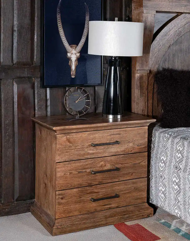 A detailed view of the El Paso Triple Drawer Nightstand’s Vintage Natural finish, emphasizing its rustic charm and sophisticated craftsmanship.