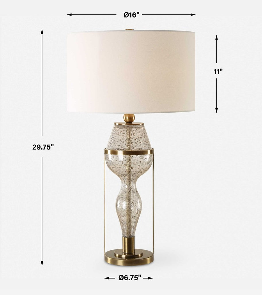 Sophisticated hourglass table lamp combining antique brass and textured glass with a minimalist linen shade.