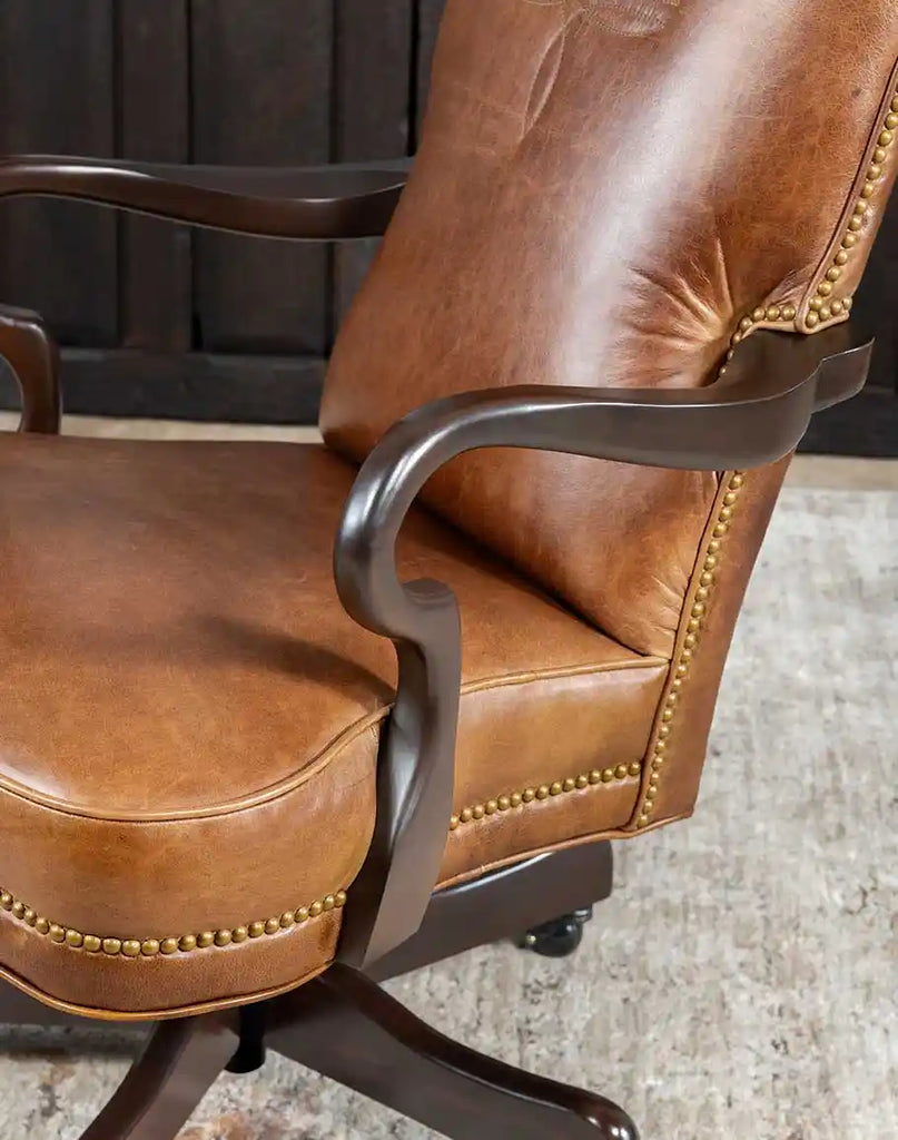 Close-up of the brass nailhead trim running along the seat and backrest edges of the Baileys Boot Stitch Office Chair.