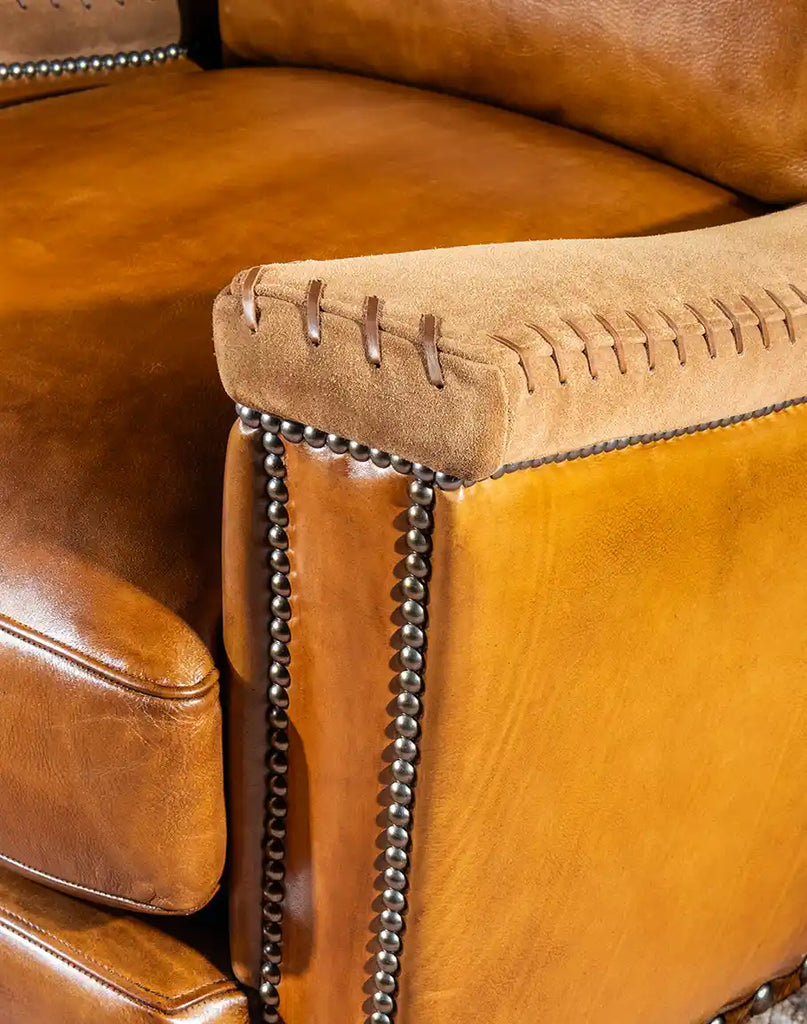 Close-up image focusing on the fine stitching details of the Norseman Leather Chair, a testament to its craftsmanship.