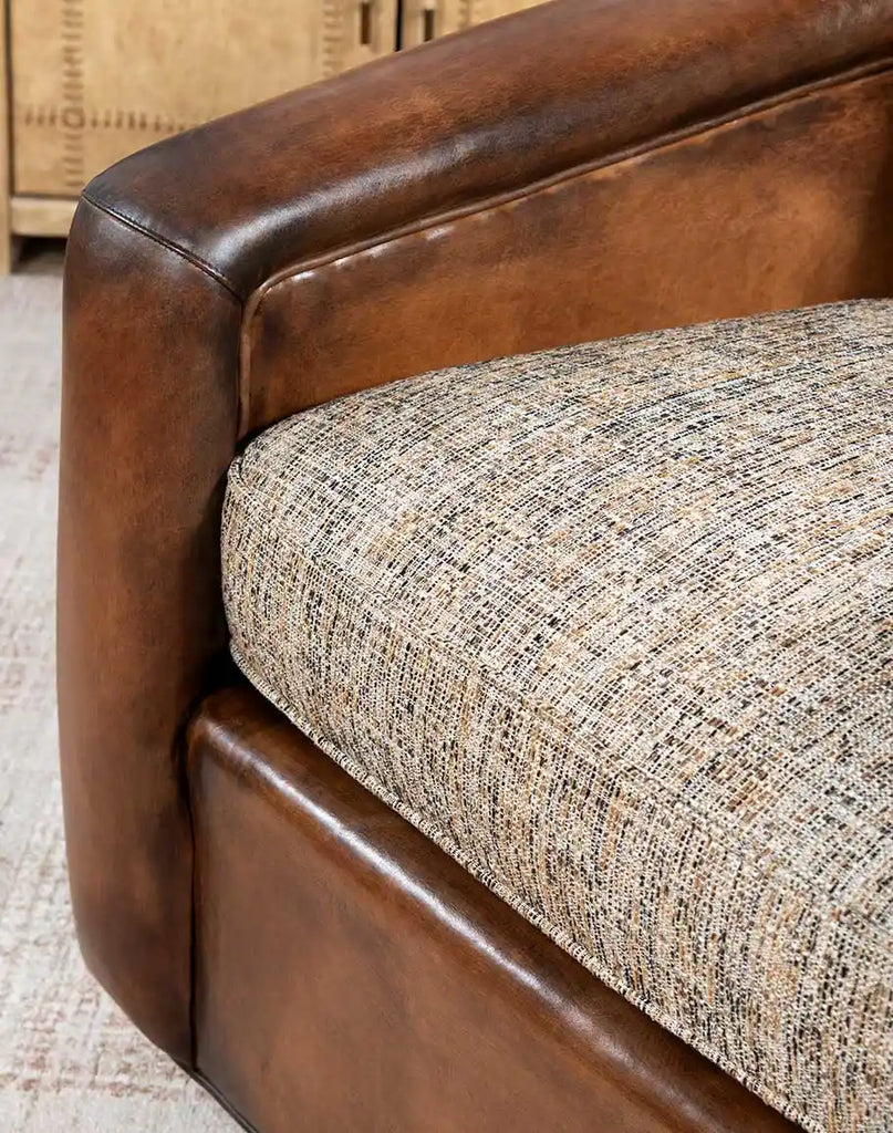 Image showcasing the removable seat and back cushions of the Elsa Cocoa Swivel Chair for easy maintenance.