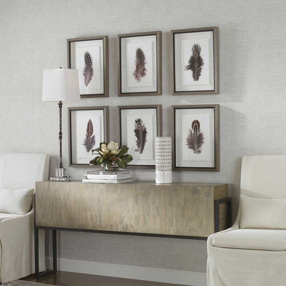 Exquisite framed feather art featuring natural hues, rustic frames, and hand-applied deckled edges.