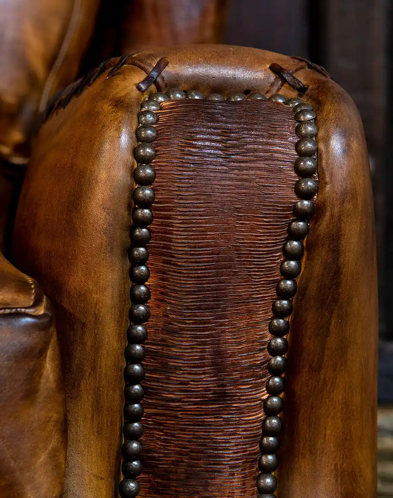 Close-up of the brass nail head detailing along the edges of the Farmhouse Ranch Chair, adding a touch of Western elegance.