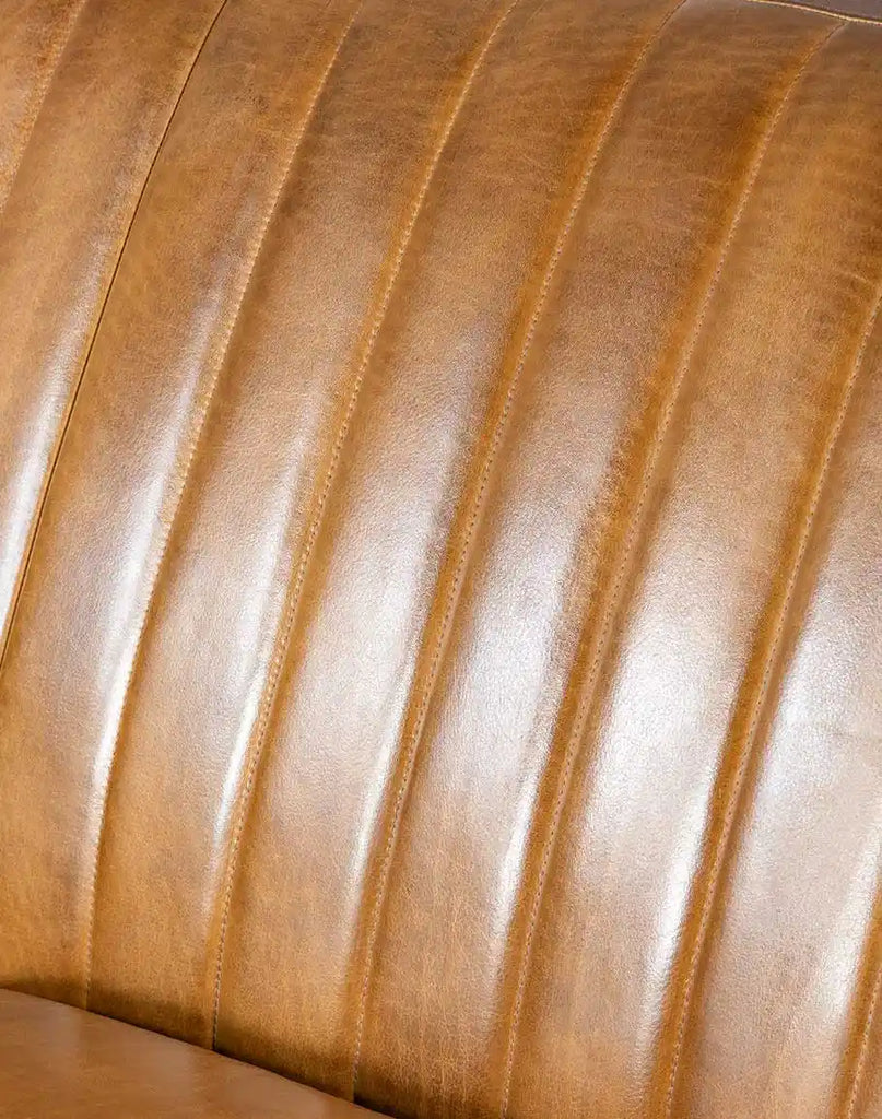 Close-up of the padded stitch design on the inside seat back of the Fox Saddle Leather Sofa, adding texture and comfort.