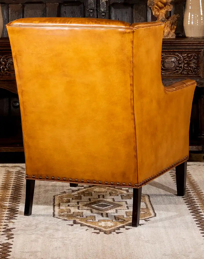 Rear image showing the tailored back and elegant silhouette of the French Leather Chair.