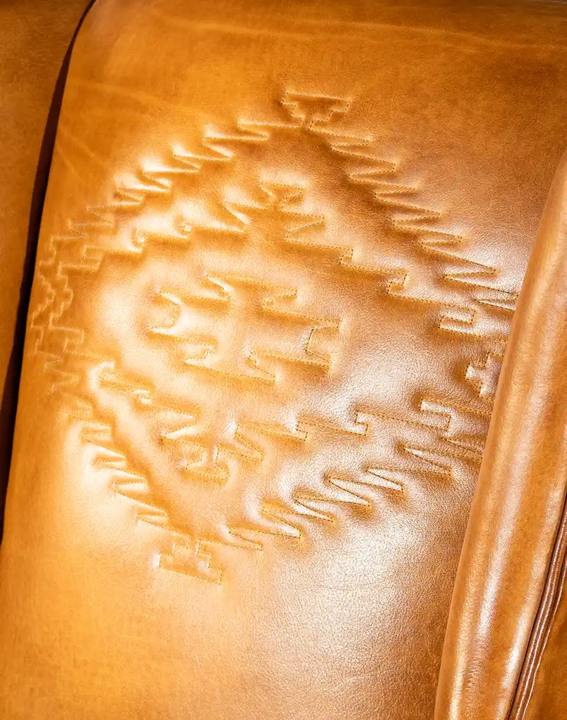 Detailed shot focusing on the rich leather texture, showcasing the quality and craftsmanship of the French Leather Chair.