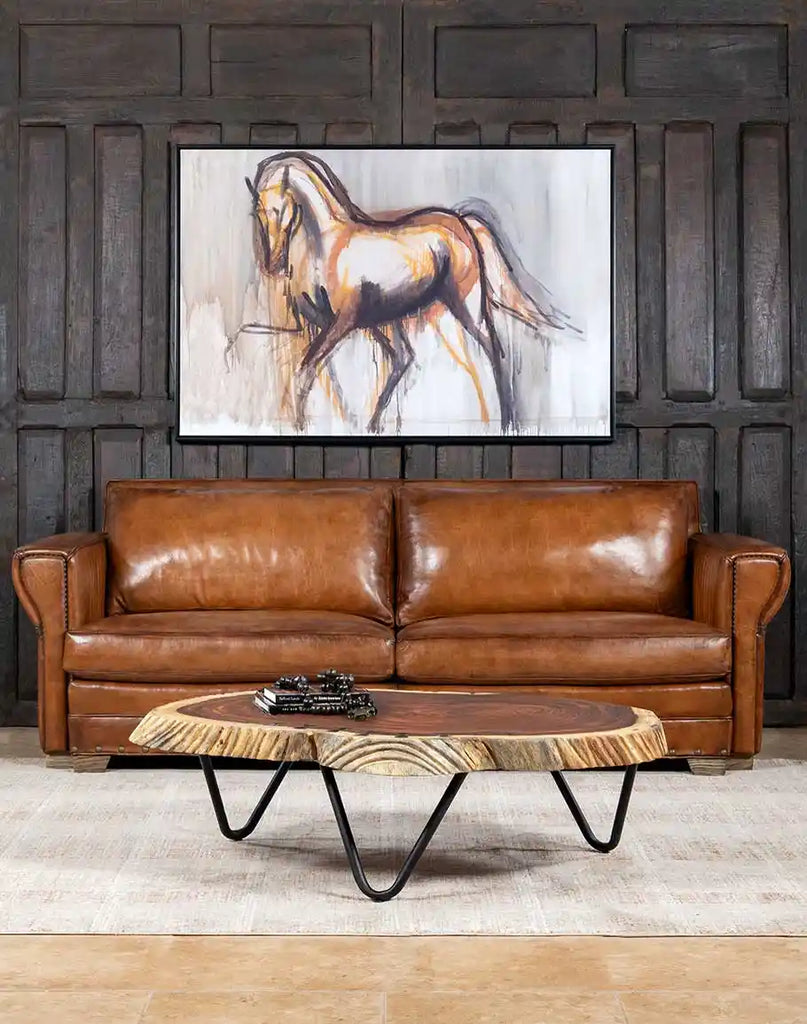 Front view of the Herdsman Western Leather Sofa showcasing its modern rustic design and hand-burnished leather finish.