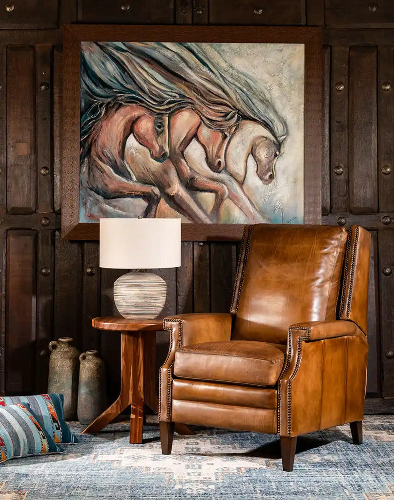 The Gents Saddle Leather Recliner styled in a rustic living room, complementing a warm and sophisticated home décor.