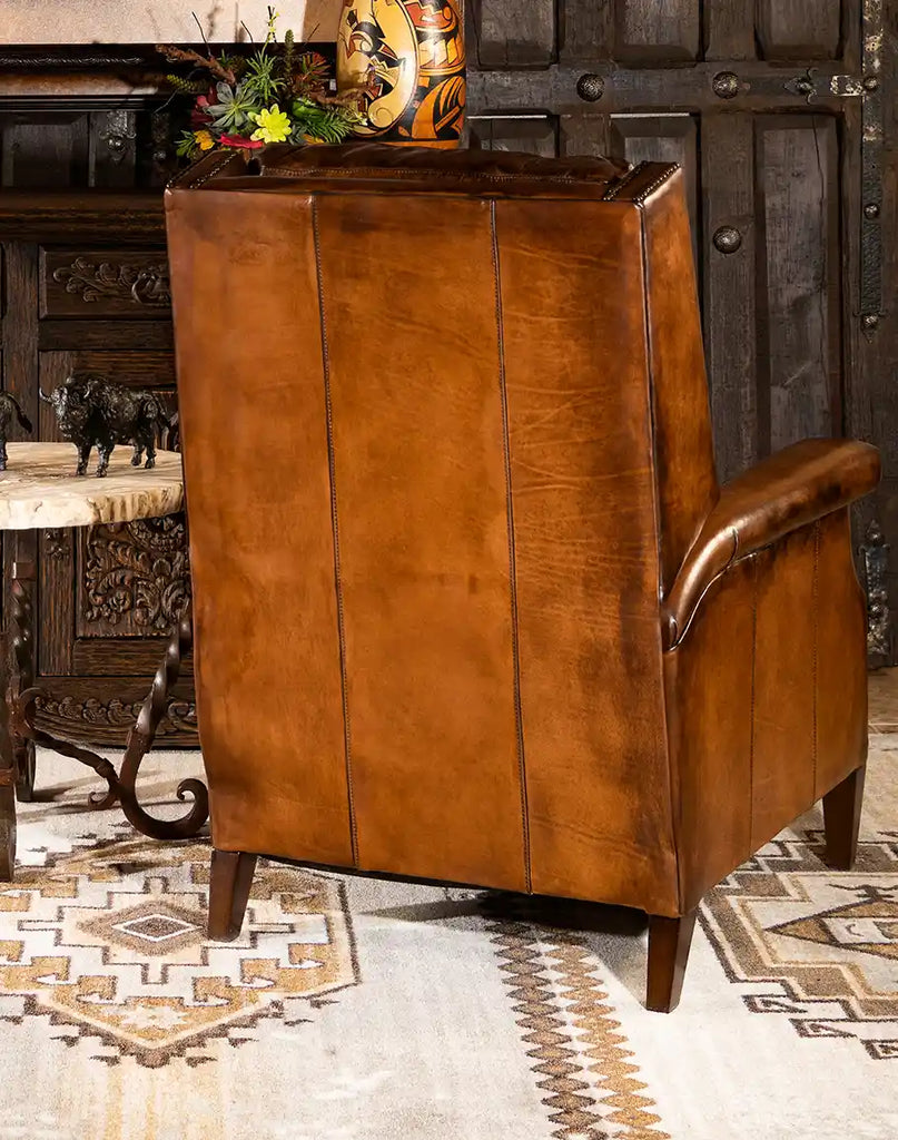 Rear angle of the Gents Tan Leather Recliner, emphasizing its refined structure and expert stitching.