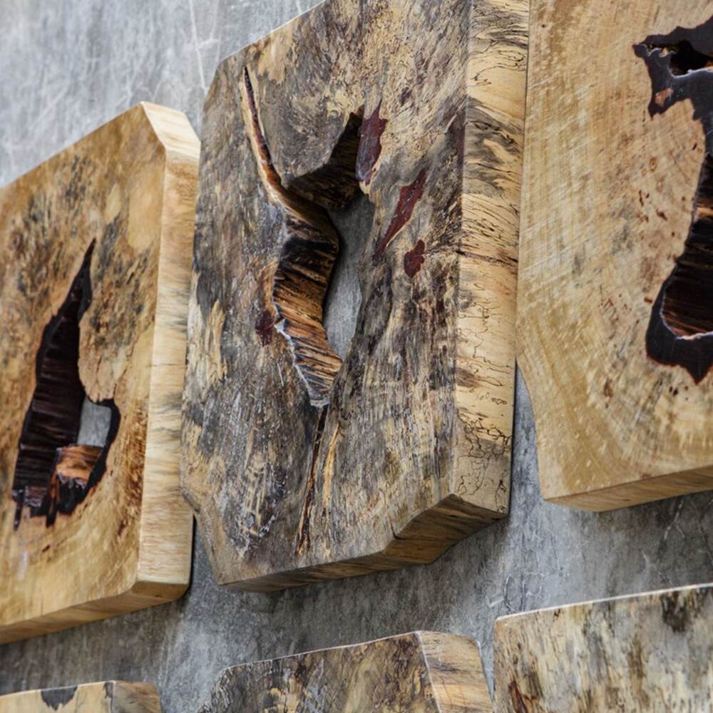 Natural tamarind wood wall pieces in a set of 9, perfect for rustic interiors