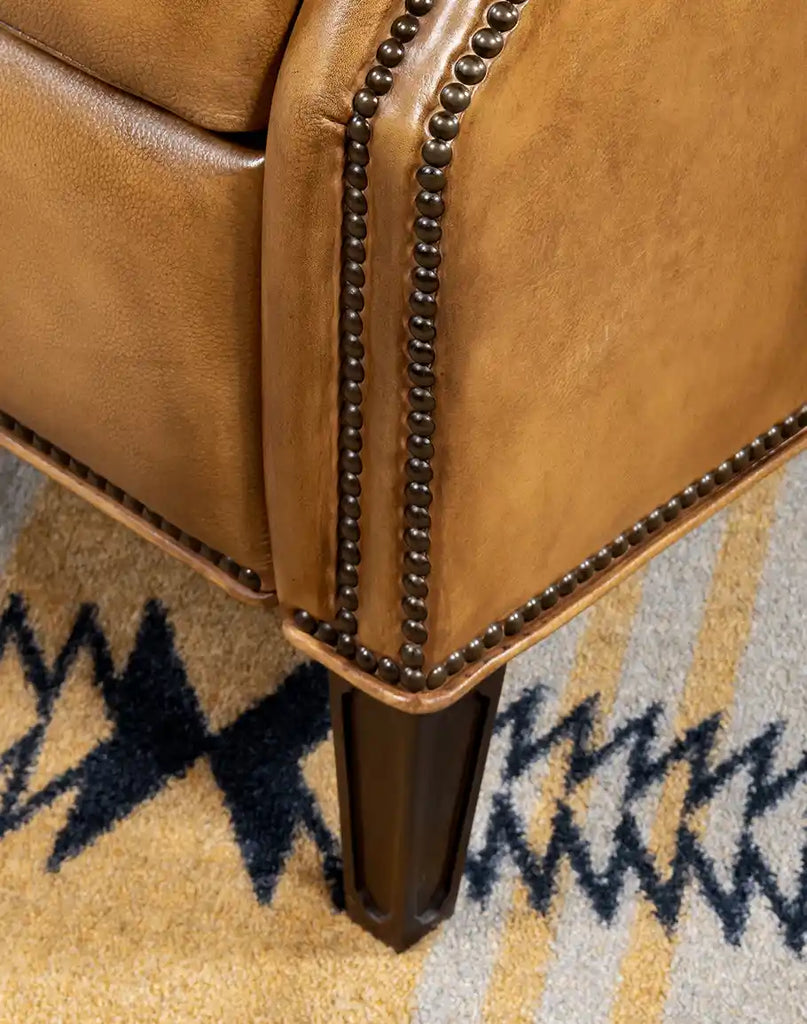 Close-up view of the hardwood frame base that supports the St. Lauriat Leather Recliner.