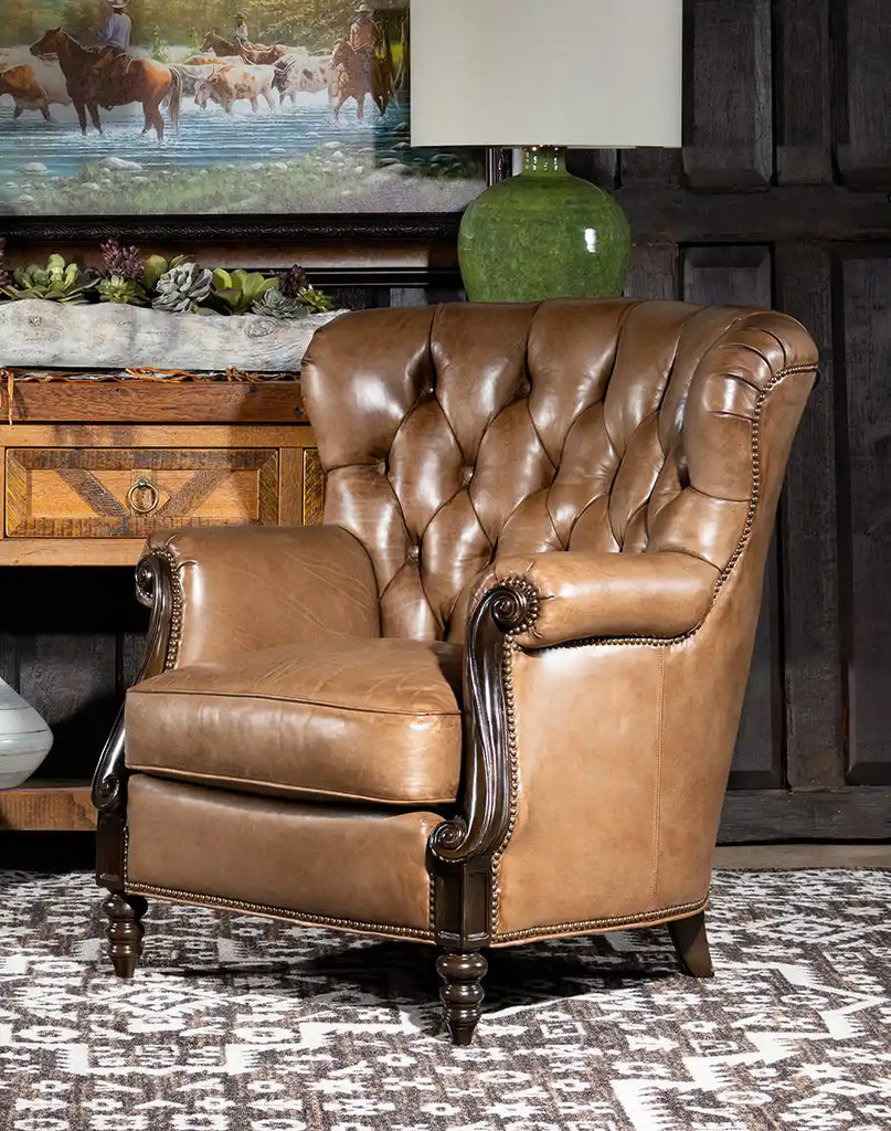 Angled view of the Hector Tufted Leather Chair, emphasizing its plush cushioning and elegant silhouette.