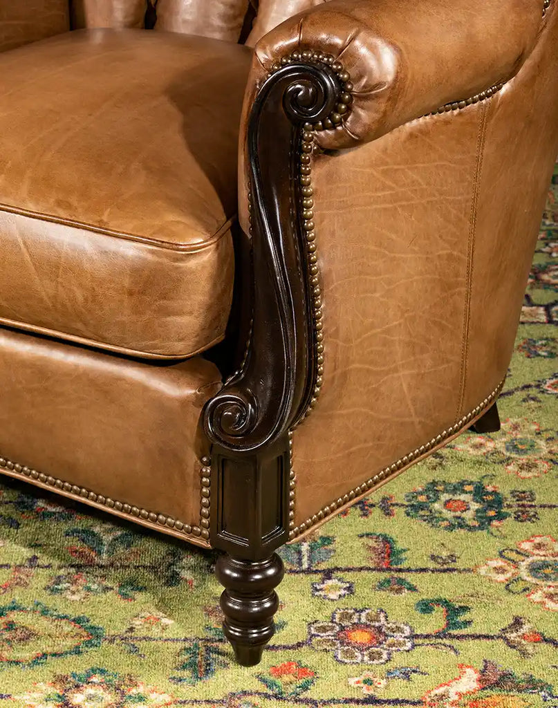 Detailed image focusing on the armrest, highlighting the fine stitching and studding of the Hector Tufted Leather Chair.