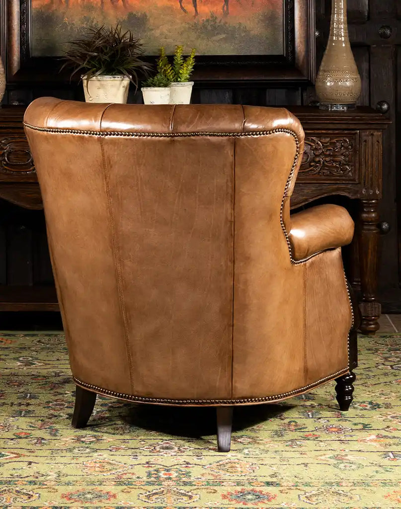 Rear image showing the tailored back and studding detail of the Hector Tufted Leather Chair.