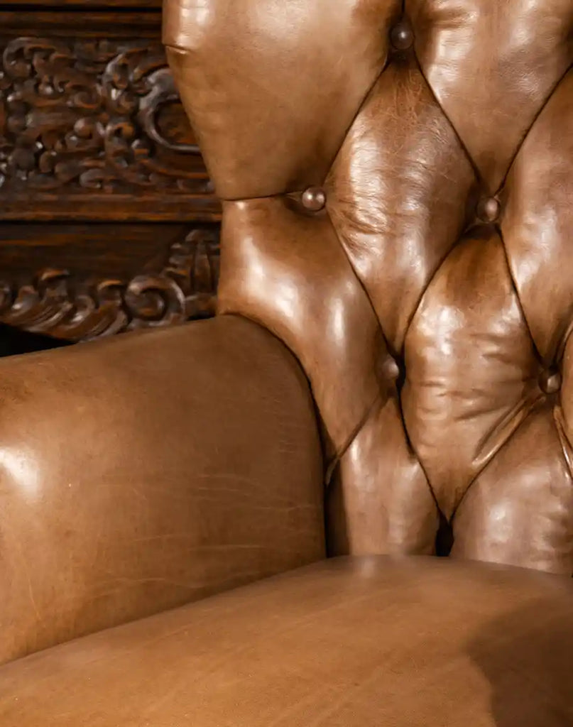 Detailed shot focusing on the tufted backrest, showcasing the craftsmanship and luxurious leather texture of the Hector Tufted Leather Chair.