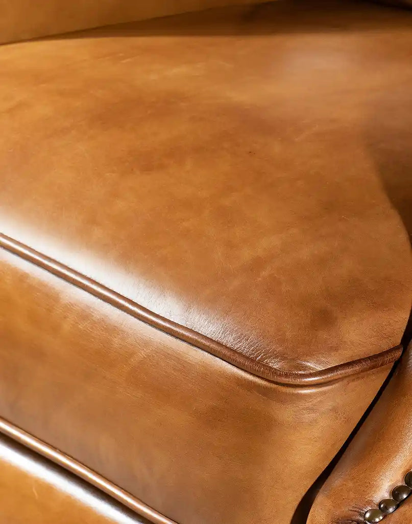 Detailed view of the Hollywood Recliner's hand-burnished leather, emphasizing its rich texture and premium craftsmanship.