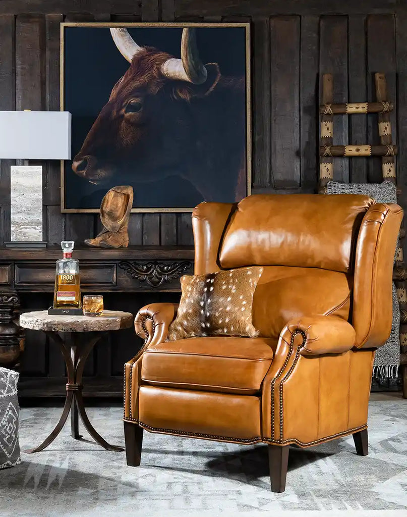 Hollywood Leather Recliner placed in a rustic living room with wooden furniture and warm lighting.