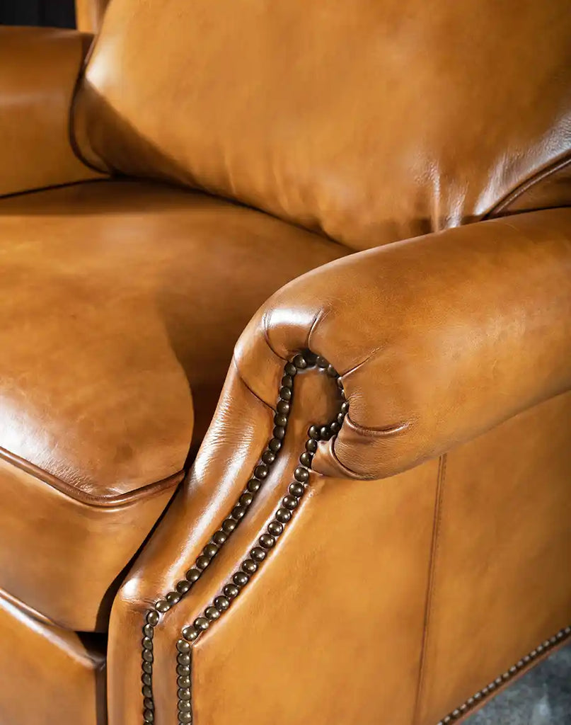 Side profile of the Hollywood Leather Recliner, highlighting the plush seat cushion and rolled armrests for added comfort.