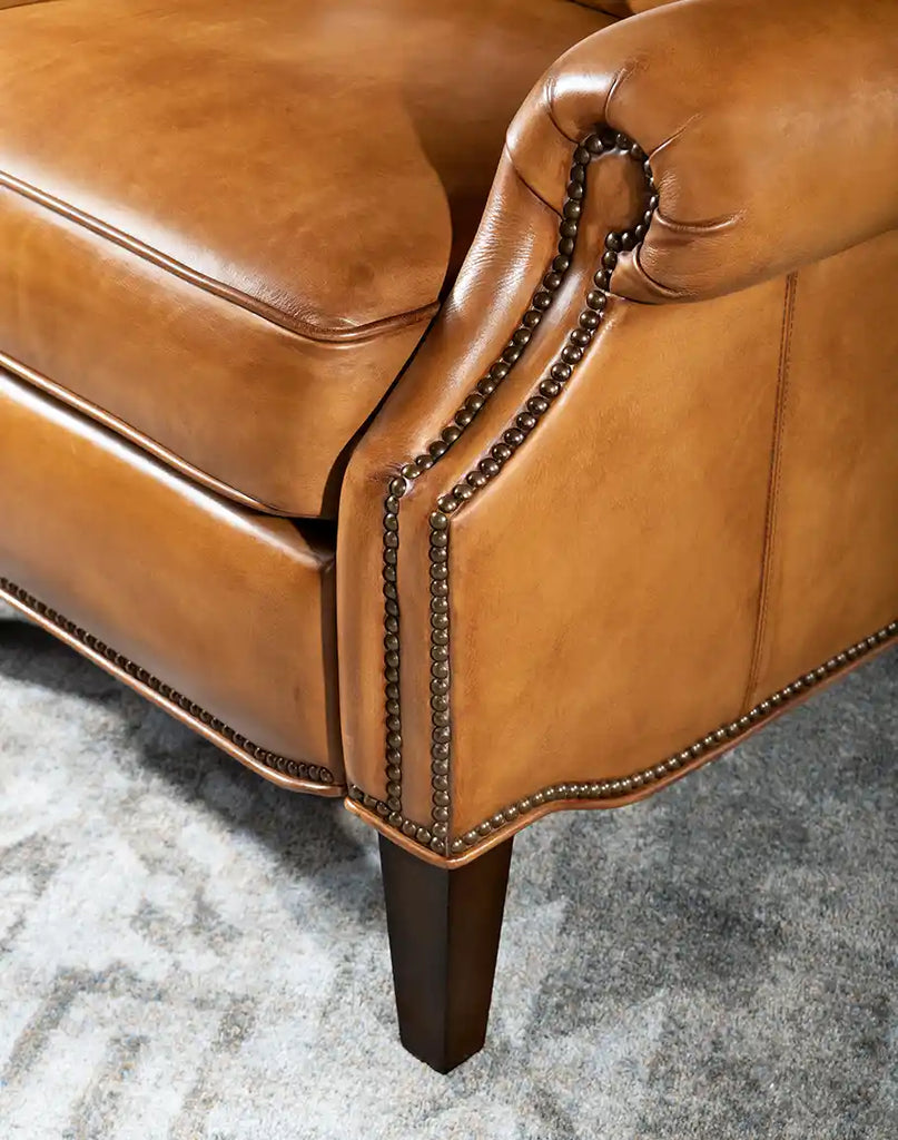 Close-up of the wooden leg on the Hollywood Leather Recliner, showcasing their sturdy craftsmanship and polished finish.