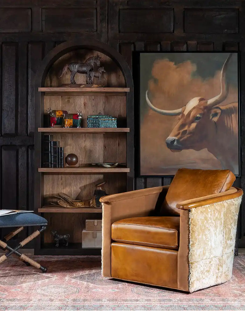 The Hoof Boot Leather Swivel Chair placed in a living room, adding elegance and sophistication to the space.