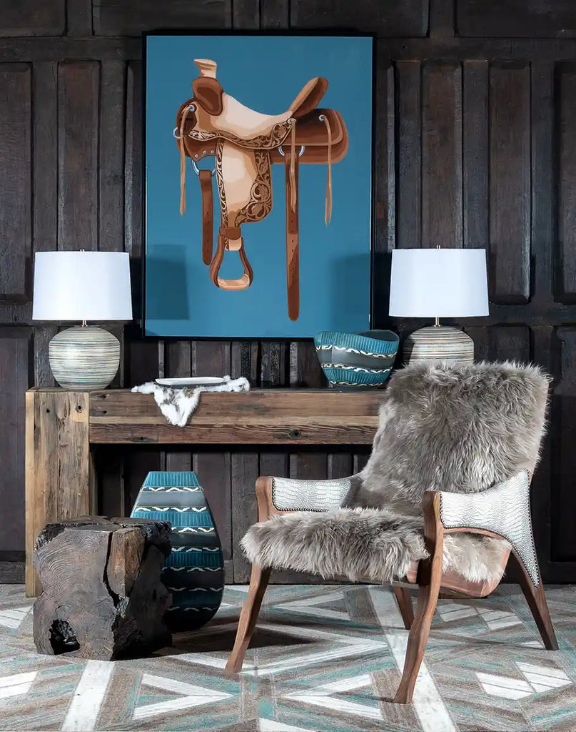 The Horse Saddle Framed Art displayed in a rustic interior setting, adding a touch of western charm and modern sophistication to the room.