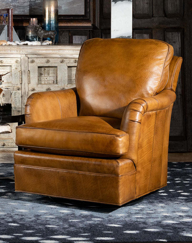 Hulton Swivel Glide Chair showcasing hand-burnished leather and intricate studding.