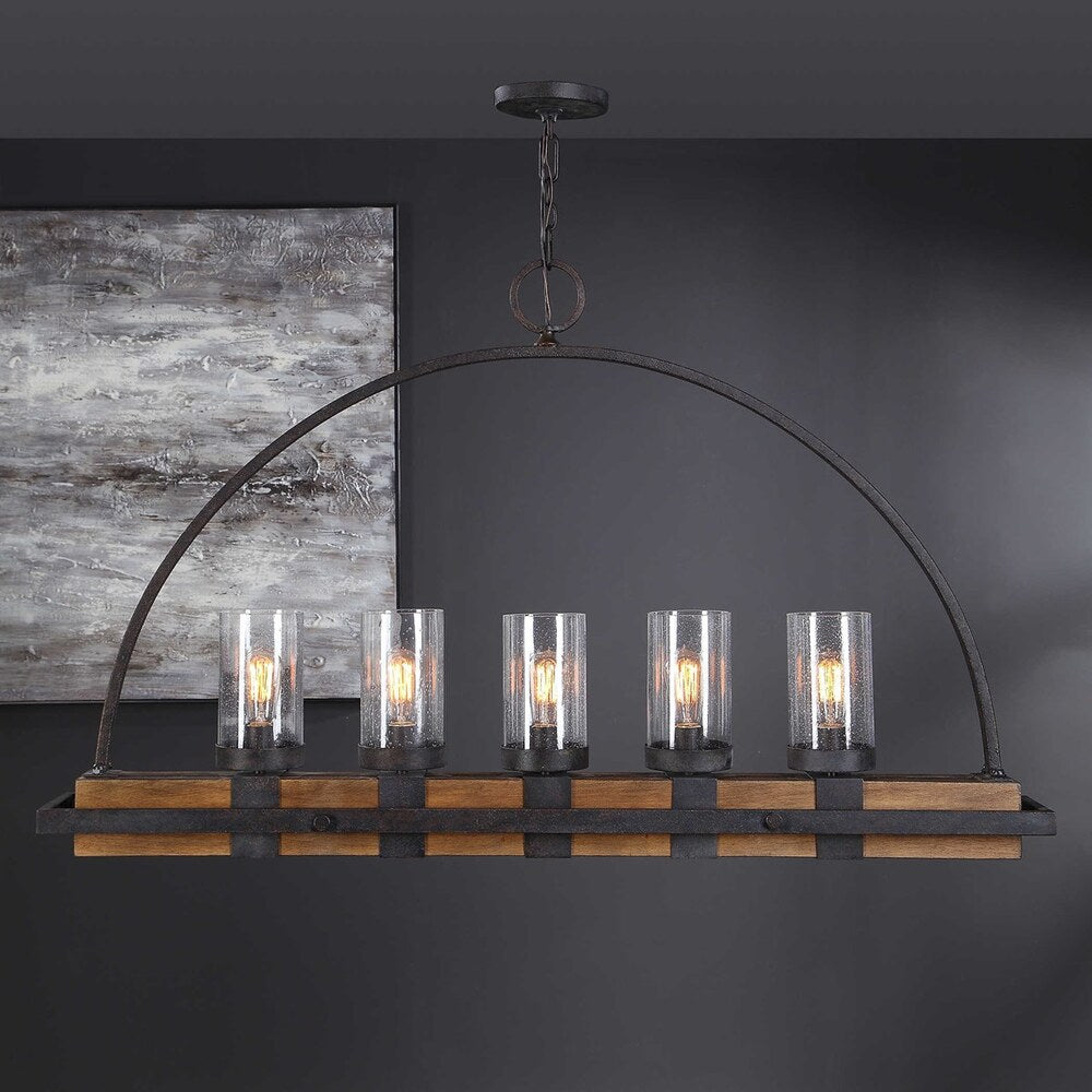 Industrial farmhouse chandelier with a real wood linear body, seeded glass shades, and iron-wrapped frame.